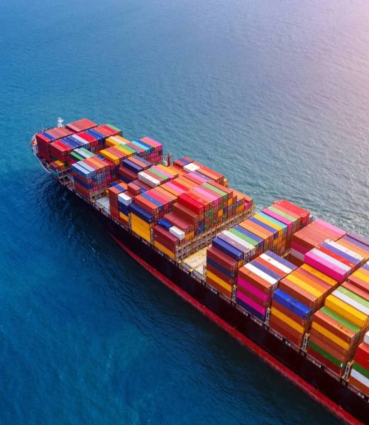 Aerial view of container cargo ship in sea.